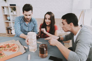 Young Smiling People Have Fun on Party at Home.
