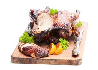 Roasted  duck with orange sauce isolated on white