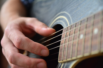 Playing the Wooden Acoustic Guitar