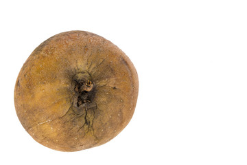 Withered old apple which has wrinkles on white background,