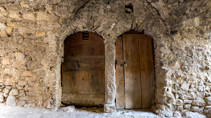 old door in stone wall