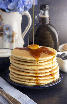 Stack of Freshly Made American Style Pancakes with Metling Butter
