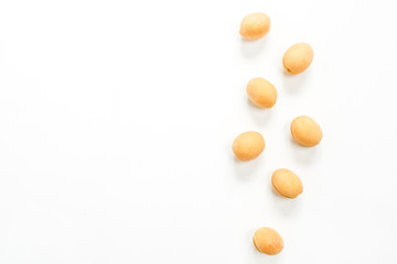 Yellow apricots isolated on white background. Flat lay, top view.