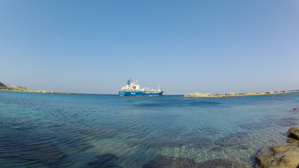 the tanker at the sea is refueled with oil