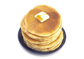Stack of Freshly Made American Style Pancakes with Metling Butter