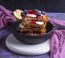 French toast with jam, sour cream and fruit