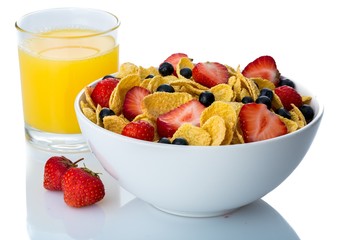 Bowl of Cornflakes, Blueberries, Strawberries and Orange Juice