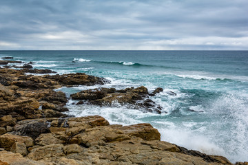 Waves breaking against the coastal rocks