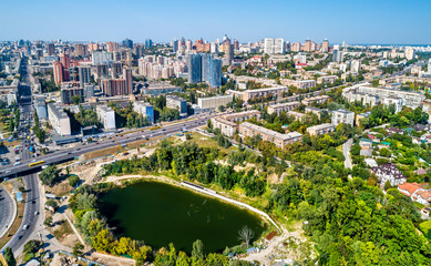 Aerial view of Kiev with residential buildings and Hlinka Lake