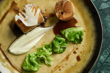 Chicken galantine, mushroom fricassee, young cabbage and sauce. chicken sausage with baked green cabbage. Healthy diet food concept.
