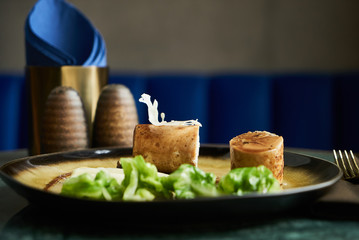 Chicken galantine, mushroom fricassee, young cabbage and sauce. chicken sausage with baked green cabbage. Healthy diet food concept.