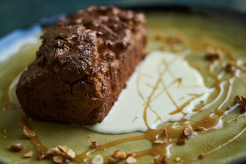 Chocolate dessert fondant with a liquid and pistachio ice cream, close-up