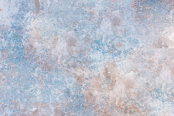Background concrete wall with light blue old cracked paint texture