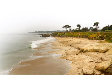 Overcast day on the beach at Santa Cruz, California with ocean faded into white background