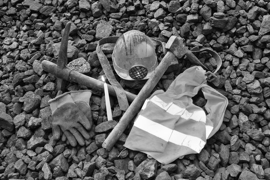Vigil light, candle with the miner belongings (helmet, gloves, pickaxe, vest, belt)