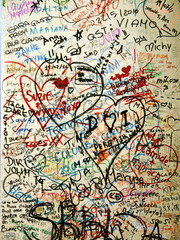 Lovers write messages on a wall close to Juliette´s house