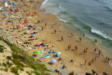 Aerial View Of People Relaxing On Beach In Portugal
