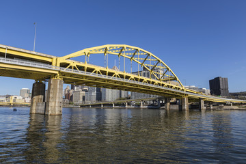 Downtown urban waterfront and Route 279 bridge crossing the Allegheny and Ohio Rivers in Pittsburgh, Pennsylvania.