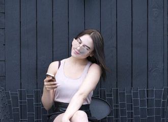 Portrait of good-looking girl with telephone