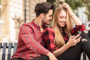 Smiling beautiful couple dating outdoors.