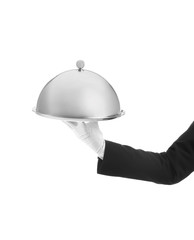 Waiter holding metal tray with lid on white background