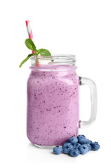 Tasty blueberry smoothie in mason jar on white background © New Africa