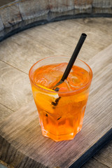 Alcohol cocktail on wooden table. Top view.