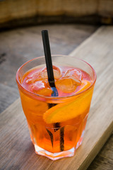 Alcohol cocktail on wooden table. Top view.