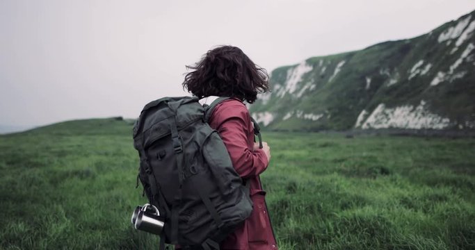 Millennial walking on a rural path choosing direction