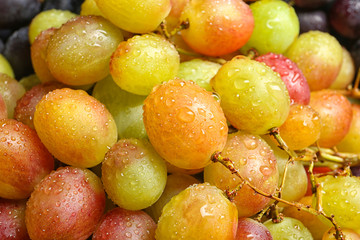 Fresh ripe juicy grapes as background, closeup