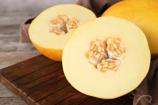 Sliced ripe sweet melon on wooden table