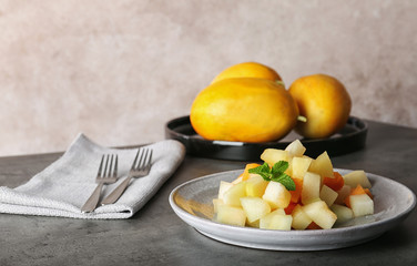 Plate of salad with assorted melons on table
