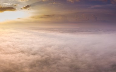 Obraz na płótnie Canvas Beautiful foggy sunrise landscape from drone.