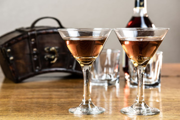 Whiskey or bourbon or mixed drink, neat, on a rustic, old, wood table