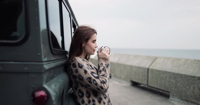 Millennial female taking a break on a road trip