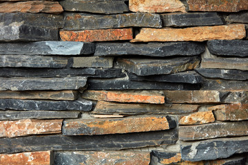 Colorful stones in cement wall texture background