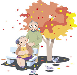 秋の公園の老夫婦