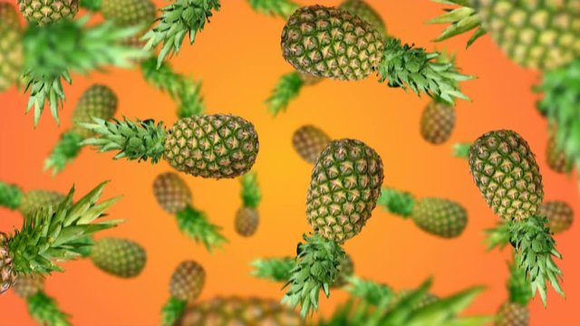 Pineapples falling down on orenge background. 4k video.