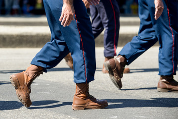 Obraz premium Military marching in a street. Legs and shoes in line