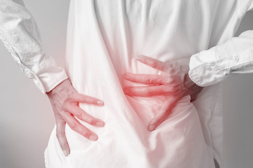 Man suffering from back pain-Healthcare and medical concept.