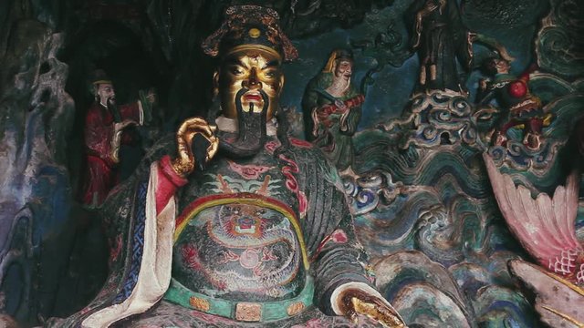 Chinese Buddhism sage statue inside a temple