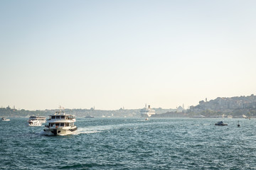 ISTANBUL, TURKEY - JULY 10, 2014: Passenger ferry ship carries people across the Bosphorus Strait...