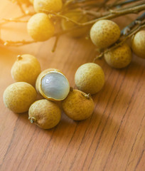 Close up Longans on Wooden Natural background with  sunlight.