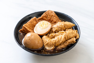 hard-boiled egg in brown sauce or sweet gravy