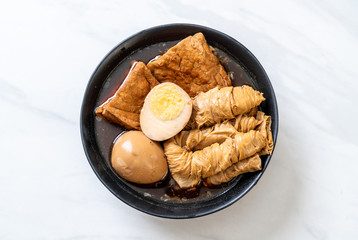 hard-boiled egg in brown sauce or sweet gravy