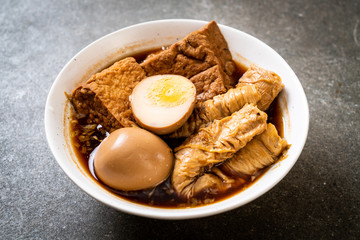 hard-boiled egg in brown sauce or sweet gravy