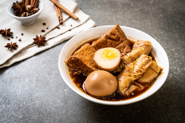 hard-boiled egg in brown sauce or sweet gravy