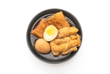 hard-boiled egg in brown sauce or sweet gravy isolated on white background