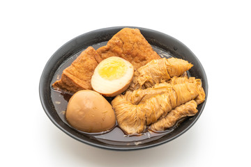 hard-boiled egg in brown sauce or sweet gravy isolated on white background