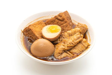 hard-boiled egg in brown sauce or sweet gravy isolated on white background